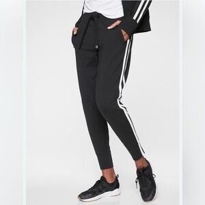 Athleta Woman’s Black Joggers with White Stripe Accents, Size Large Petite.